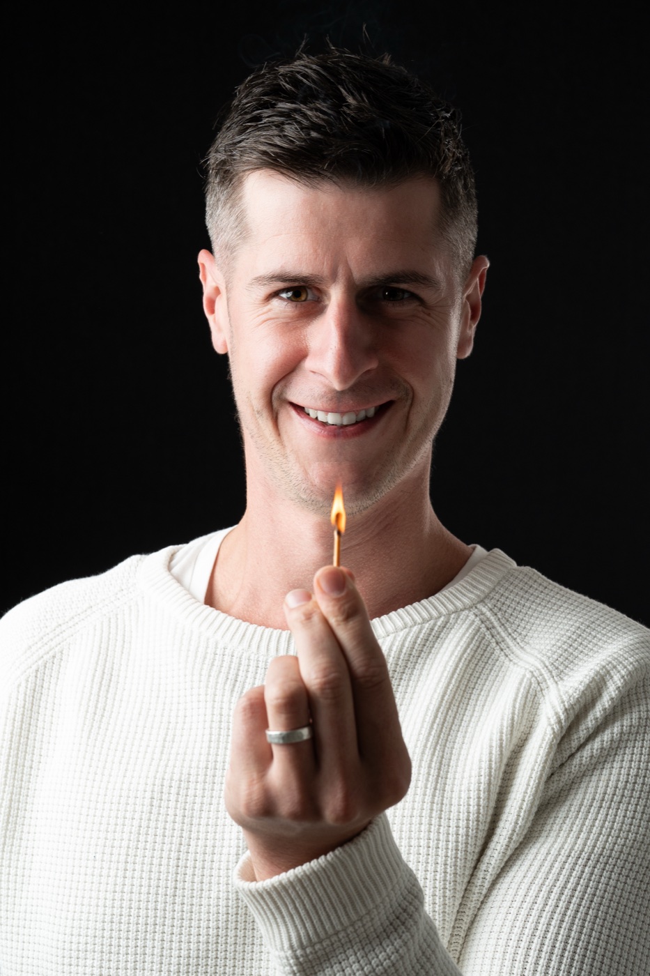 Matt Budden holding a lit match