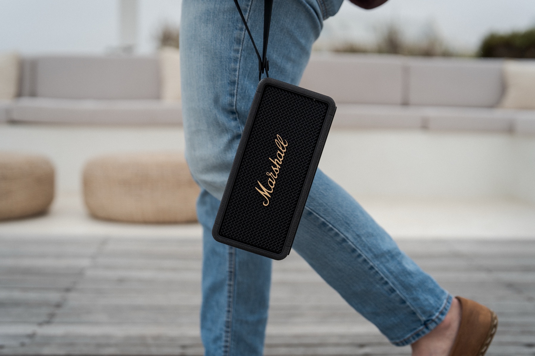 A Marshall speaker hanging from Matt Budden's shoulder