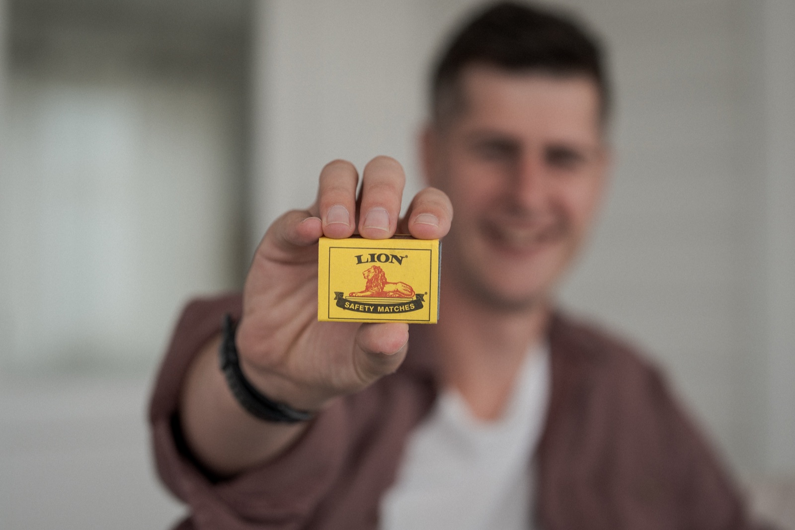 Matt Budden holding a yellow box of safety matches