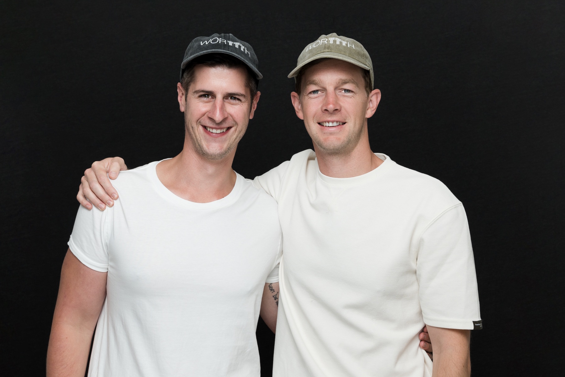 Matt Budden with a collaborator wearing WORTTTH hats